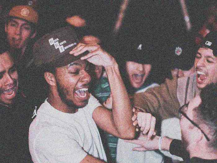 A very hype guy rocking out at a local show